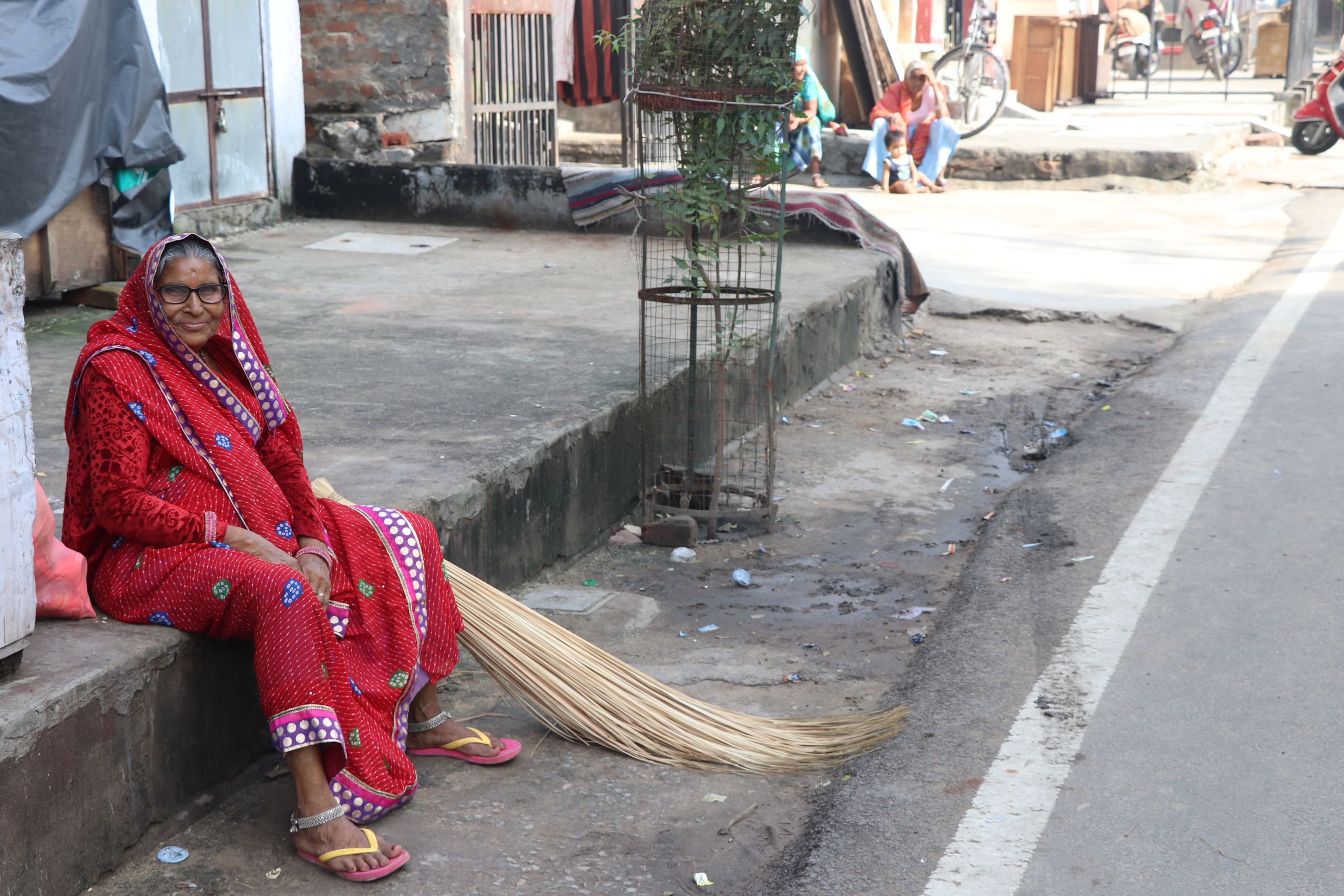 A street cleaner having a rest after sweeping the gutters